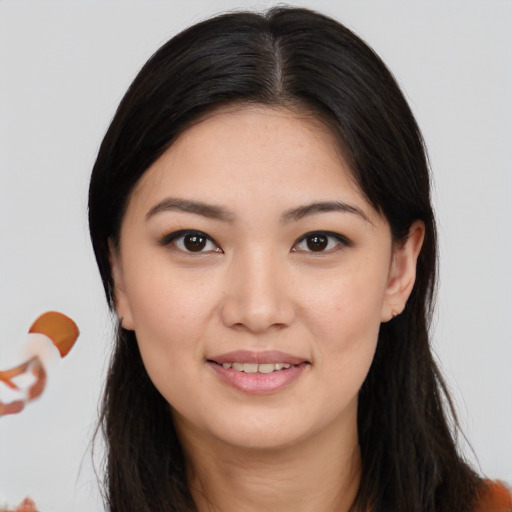 Joyful asian young-adult female with long  brown hair and brown eyes