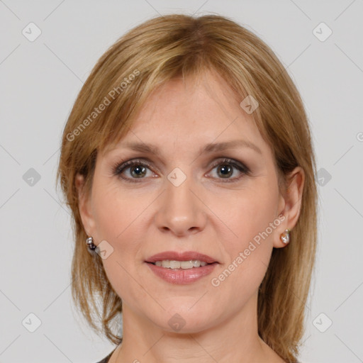 Joyful white adult female with medium  brown hair and grey eyes