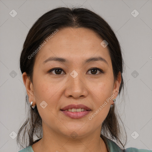 Joyful white adult female with medium  brown hair and brown eyes