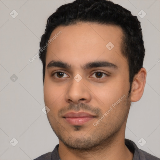 Neutral latino young-adult male with short  black hair and brown eyes