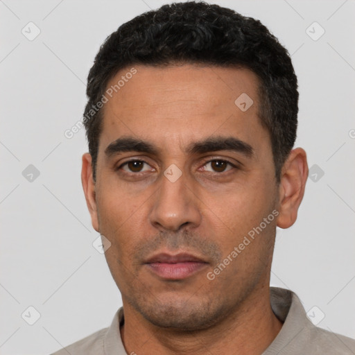 Neutral white young-adult male with short  black hair and brown eyes