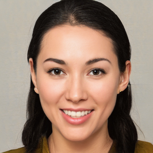 Joyful white young-adult female with long  black hair and brown eyes