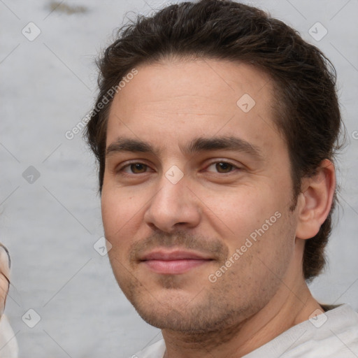 Joyful white adult male with short  brown hair and brown eyes