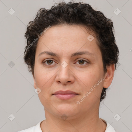 Joyful white adult female with short  brown hair and brown eyes