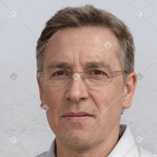 Joyful white middle-aged male with short  brown hair and brown eyes