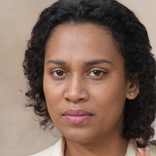 Neutral black young-adult female with medium  black hair and brown eyes