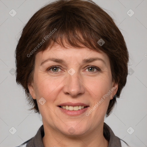 Joyful white adult female with medium  brown hair and grey eyes