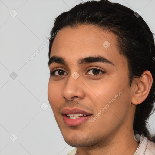 Joyful white young-adult male with short  black hair and brown eyes