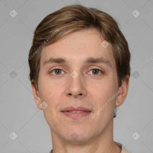 Joyful white adult male with short  brown hair and grey eyes