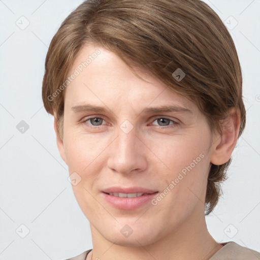 Joyful white young-adult female with short  brown hair and grey eyes