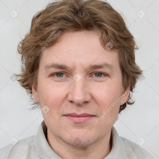 Joyful white adult male with short  brown hair and grey eyes