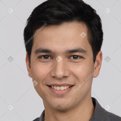 Joyful white young-adult male with short  black hair and brown eyes