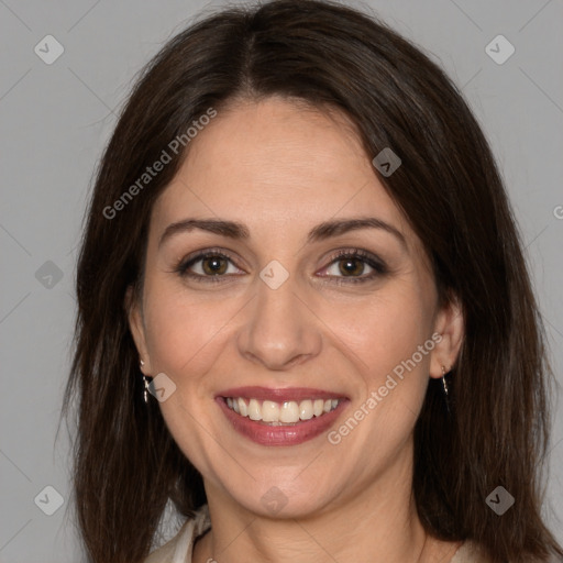 Joyful white adult female with medium  brown hair and brown eyes