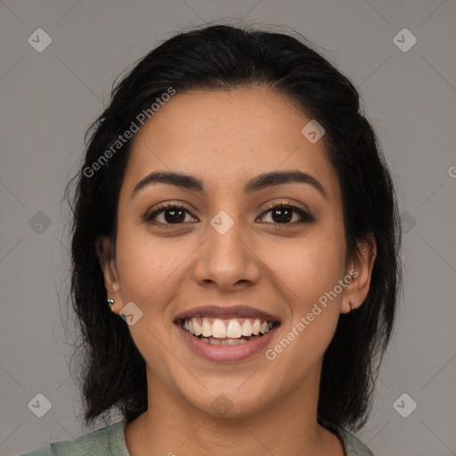 Joyful latino young-adult female with medium  black hair and brown eyes