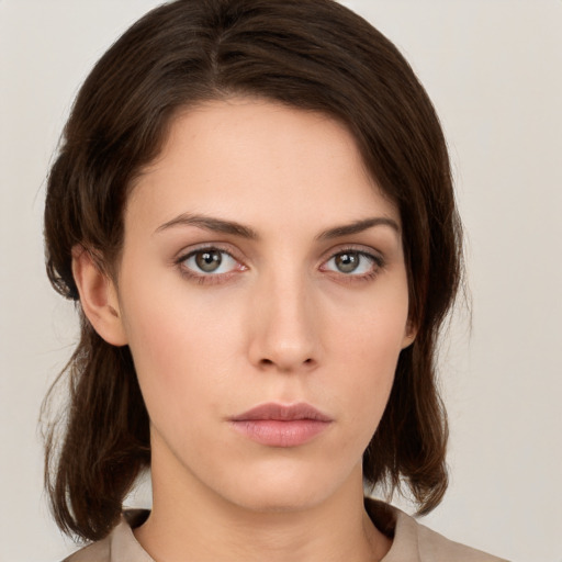 Neutral white young-adult female with medium  brown hair and green eyes