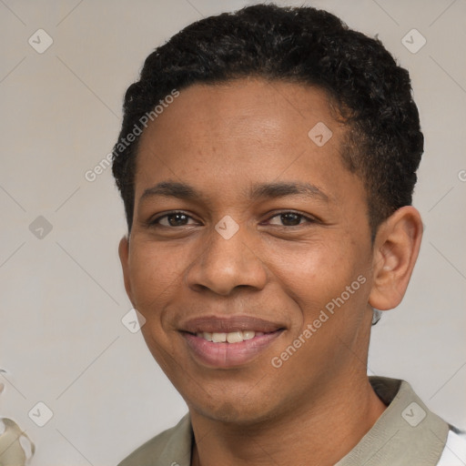 Joyful black young-adult male with short  brown hair and brown eyes