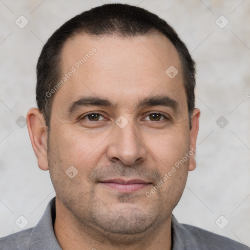 Joyful white adult male with short  brown hair and brown eyes