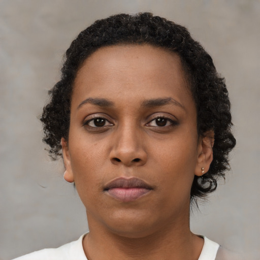 Neutral black young-adult female with short  brown hair and brown eyes