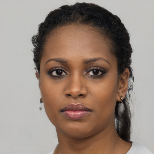 Neutral black young-adult female with short  black hair and brown eyes