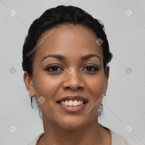 Joyful black young-adult female with short  black hair and brown eyes