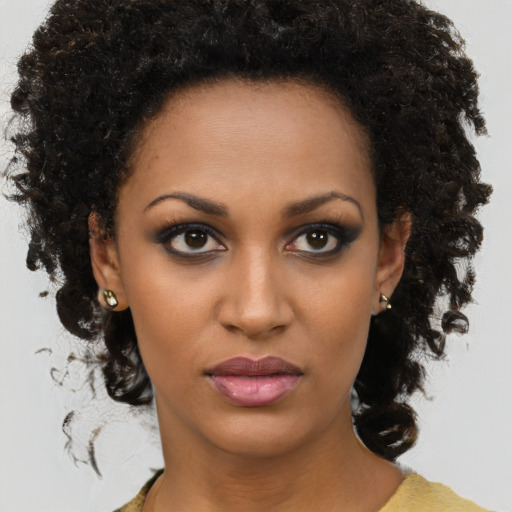 Neutral black young-adult female with medium  brown hair and brown eyes