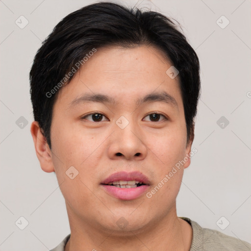 Joyful asian young-adult male with short  brown hair and brown eyes