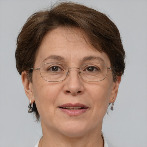 Joyful white middle-aged female with short  brown hair and grey eyes