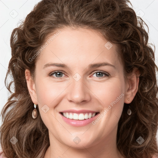 Joyful white young-adult female with long  brown hair and green eyes