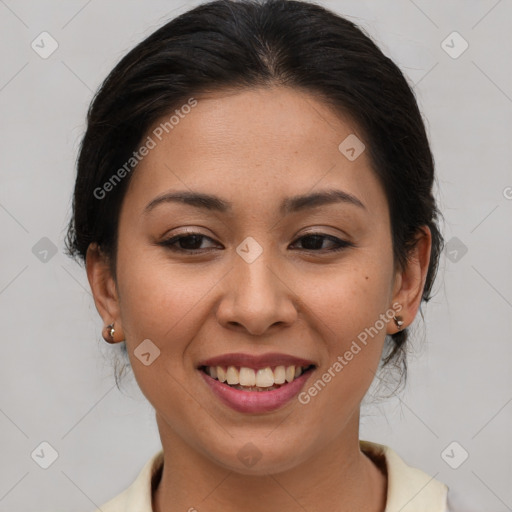 Joyful latino young-adult female with medium  brown hair and brown eyes