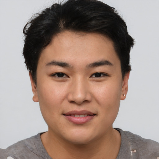 Joyful asian young-adult male with short  brown hair and brown eyes