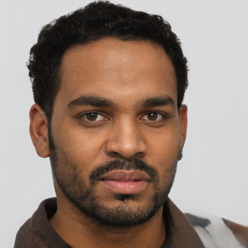Neutral black young-adult male with short  black hair and brown eyes
