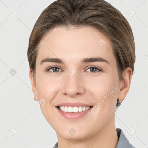 Joyful white young-adult female with short  brown hair and grey eyes