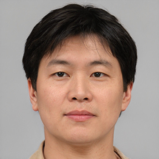 Neutral asian young-adult male with short  brown hair and brown eyes