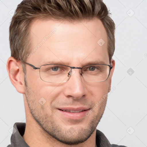 Joyful white adult male with short  brown hair and grey eyes