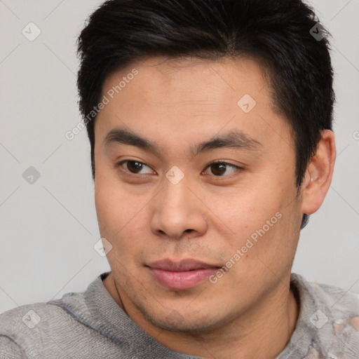 Neutral asian young-adult male with short  brown hair and brown eyes