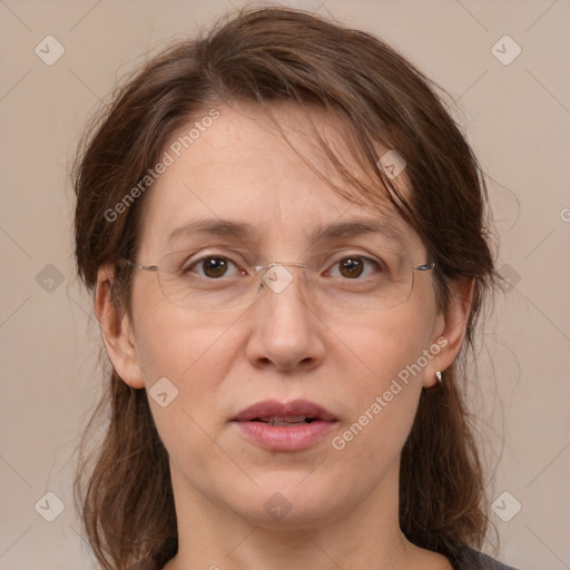 Joyful white adult female with medium  brown hair and grey eyes