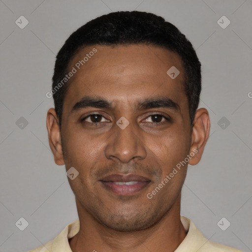 Joyful black young-adult male with short  black hair and brown eyes