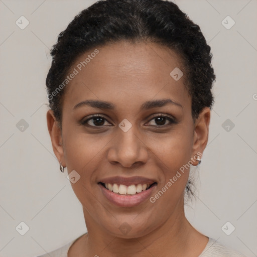 Joyful black young-adult female with short  brown hair and brown eyes