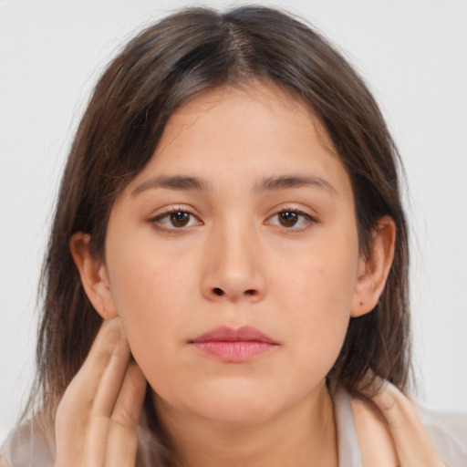 Neutral white young-adult female with medium  brown hair and brown eyes