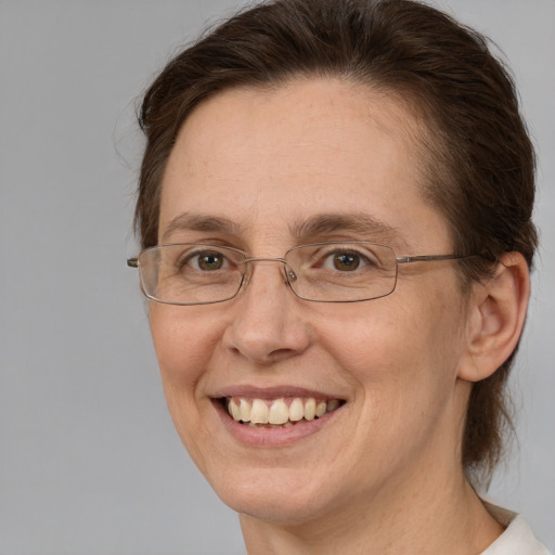 Joyful white adult female with short  brown hair and brown eyes