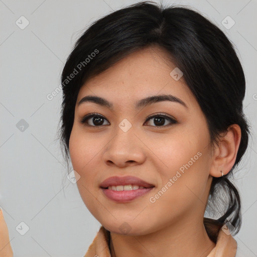 Joyful asian young-adult female with medium  black hair and brown eyes