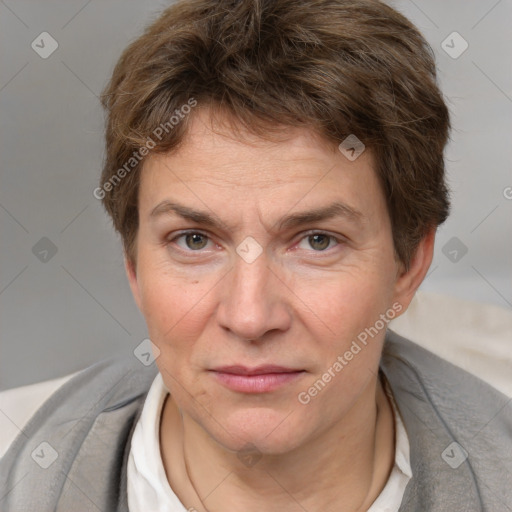 Joyful white adult male with short  brown hair and grey eyes