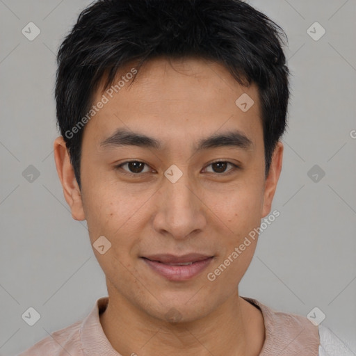 Joyful asian young-adult male with short  brown hair and brown eyes