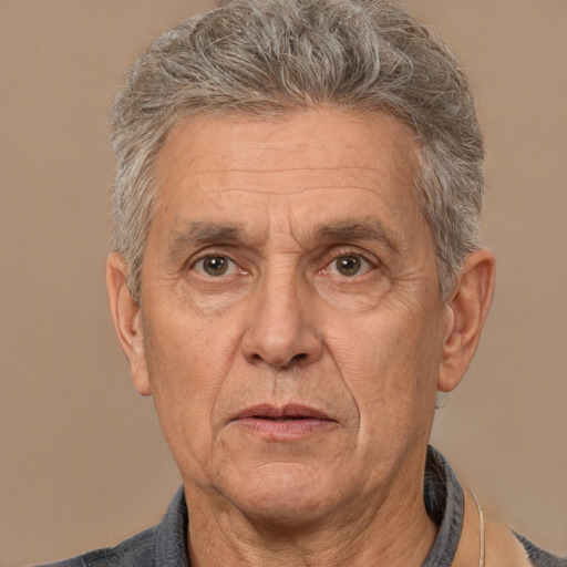 Joyful white middle-aged male with short  gray hair and brown eyes