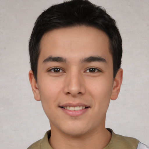 Joyful asian young-adult male with short  brown hair and brown eyes