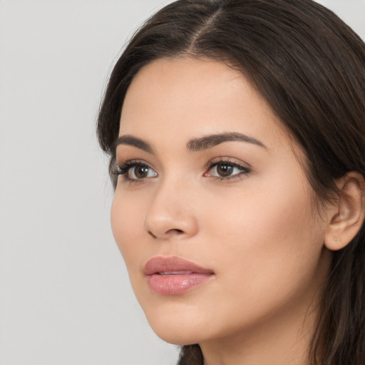 Neutral white young-adult female with long  brown hair and brown eyes