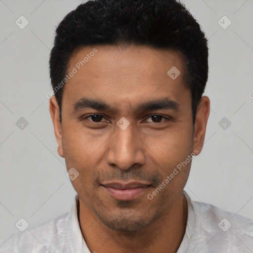 Joyful latino young-adult male with short  black hair and brown eyes