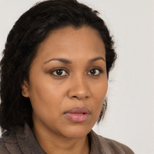 Neutral latino young-adult female with long  brown hair and brown eyes