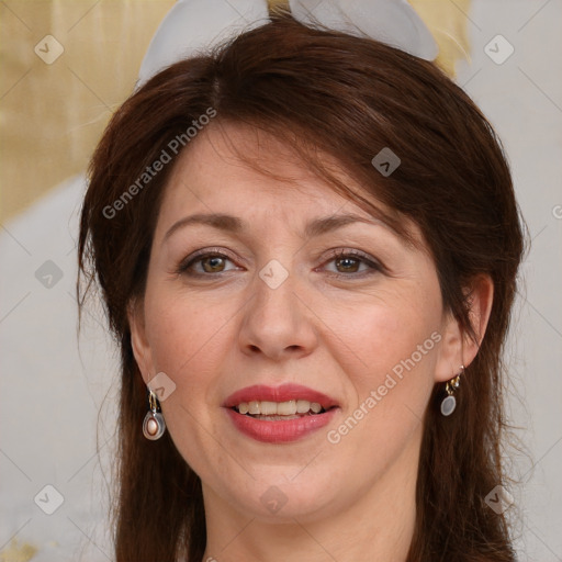 Joyful white adult female with medium  brown hair and brown eyes