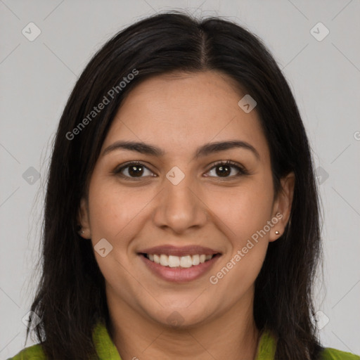 Joyful latino young-adult female with long  brown hair and brown eyes